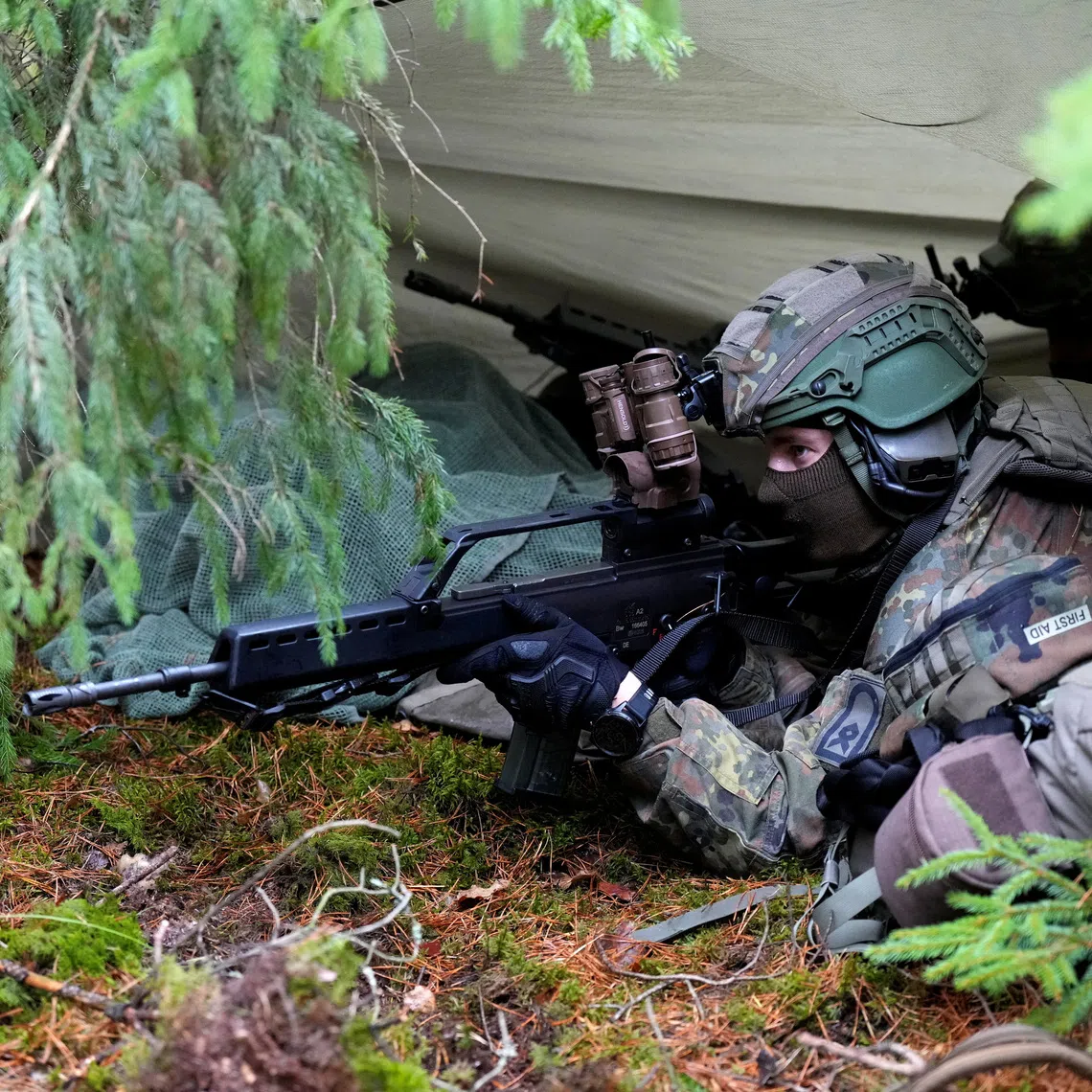 A German Defence forces serviceman guards a hide and antenna for lightweight detection system for electromagnetic spectrum during Viligant Owl media day in Paluknys air field, Lithuania October 28, 2026. REUTERS/Ints Kalnins