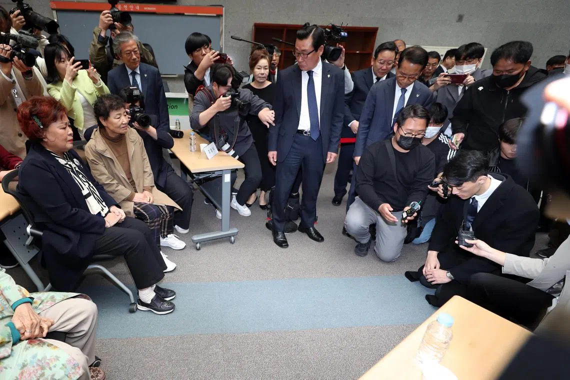 epa10551633 Chun Woo-won (R), a grandson of the late former South Korean President Chun Doo-hwan, gives a deep bow to bereaved family members in the city of Gwangju, South Korea, 31 March 2023, to offer an apology in lieu of his grandfather to the victims of a 1980 crackdown on a pro-democracy uprising in the city. The 27-year-old has referred to his grandfather as 'a slaughterer' due to the military's brutal suppression of the Gwangju uprising after he seized power through a coup in 1979.  EPA-EFE/YONHAP SOUTH KOREA OUT