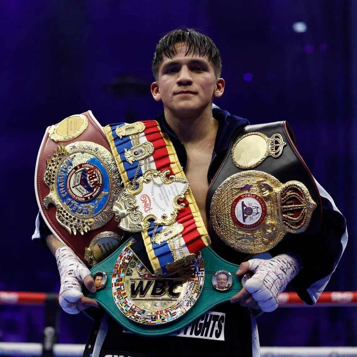 Boxing - David Benavidez v Anthony Yarde - WBC Light Heavyweight Championship - ANB Arena, Riyadh, Saudi Arabia - November 23, 2025 Jesse Rodriguez poses with his belts after winning his fight against Fernando Martinez REUTERS/Hamad I Mohammed