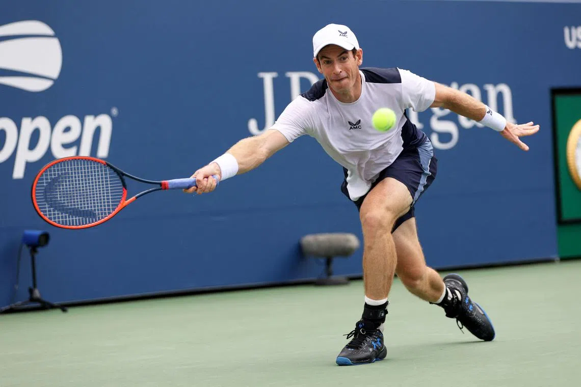 Andy Murray plays a forehand shot to Corentin Moutet of France during their US Open first-round match. 