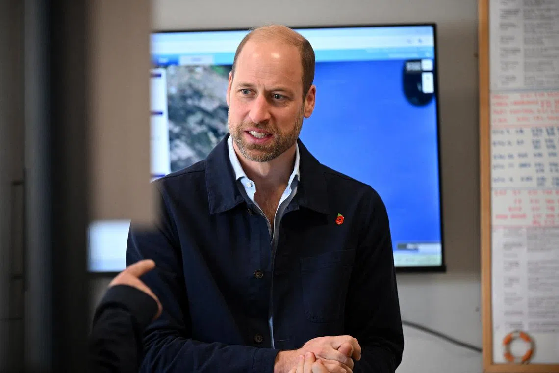 Prince William, Prince of Wales, speaks with business representatives at Portside Tower in Cape Town, South Africa, on Nov 7.