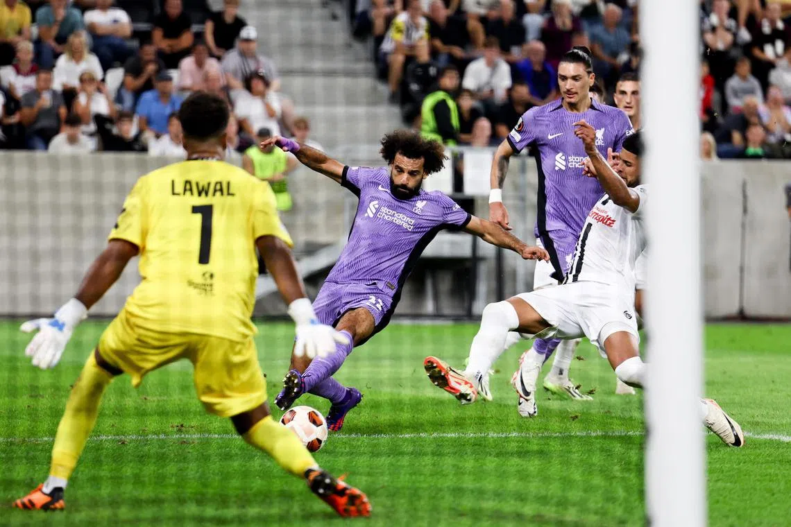Liverpool's Mohamed Salah scoring the third goal in the 3-1 Europa League win over LASK.