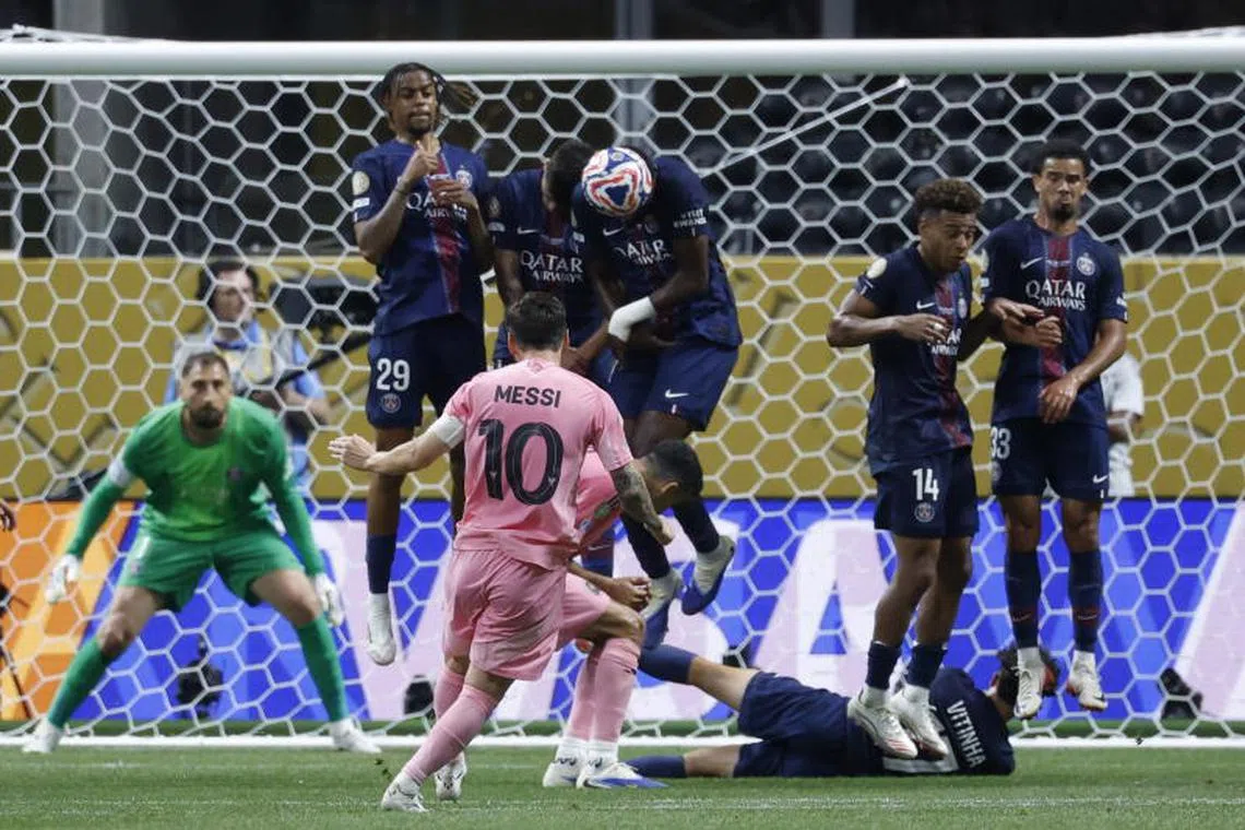 Players of Paris Saint-Germain blocks a free kick by Lionel Messi of Inter Miami.