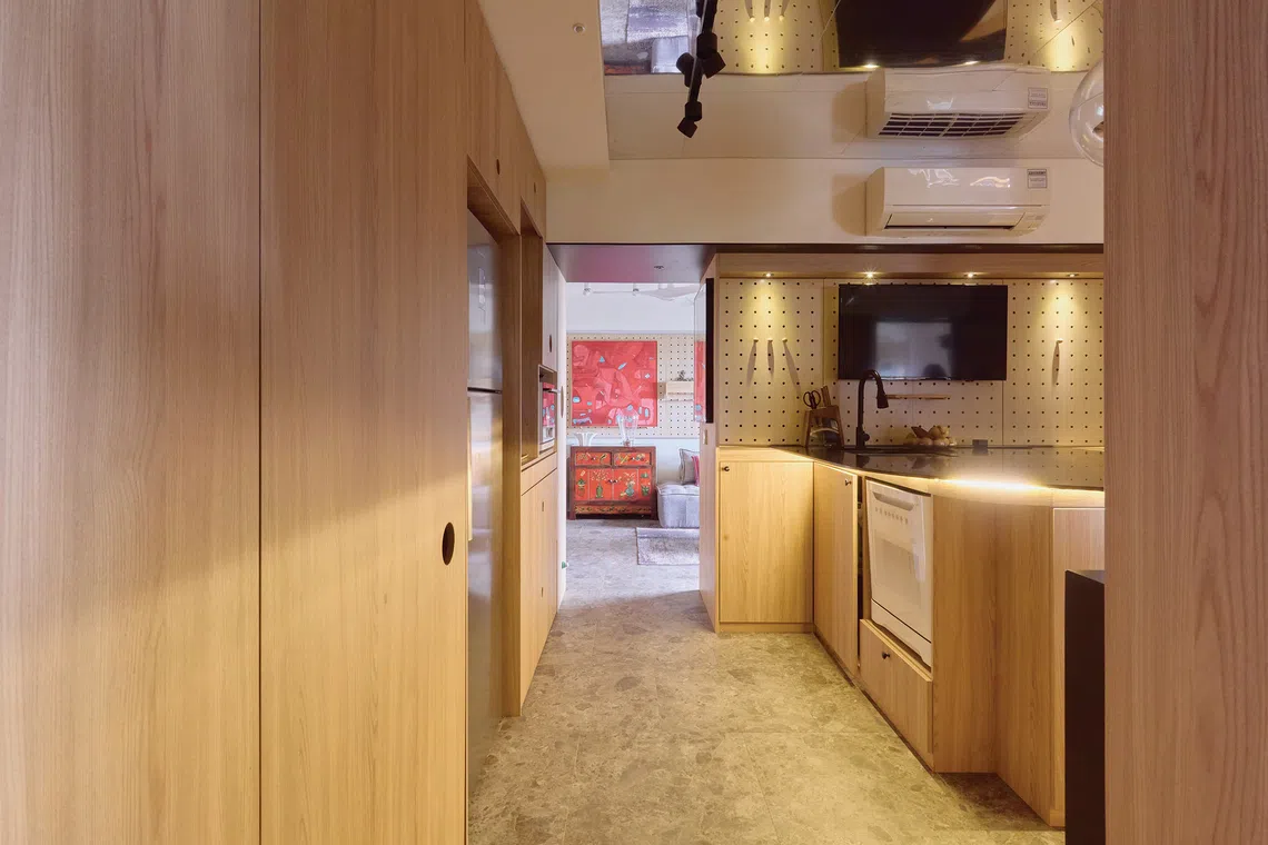 Mirrors and statement lighting brighten the kitchen.