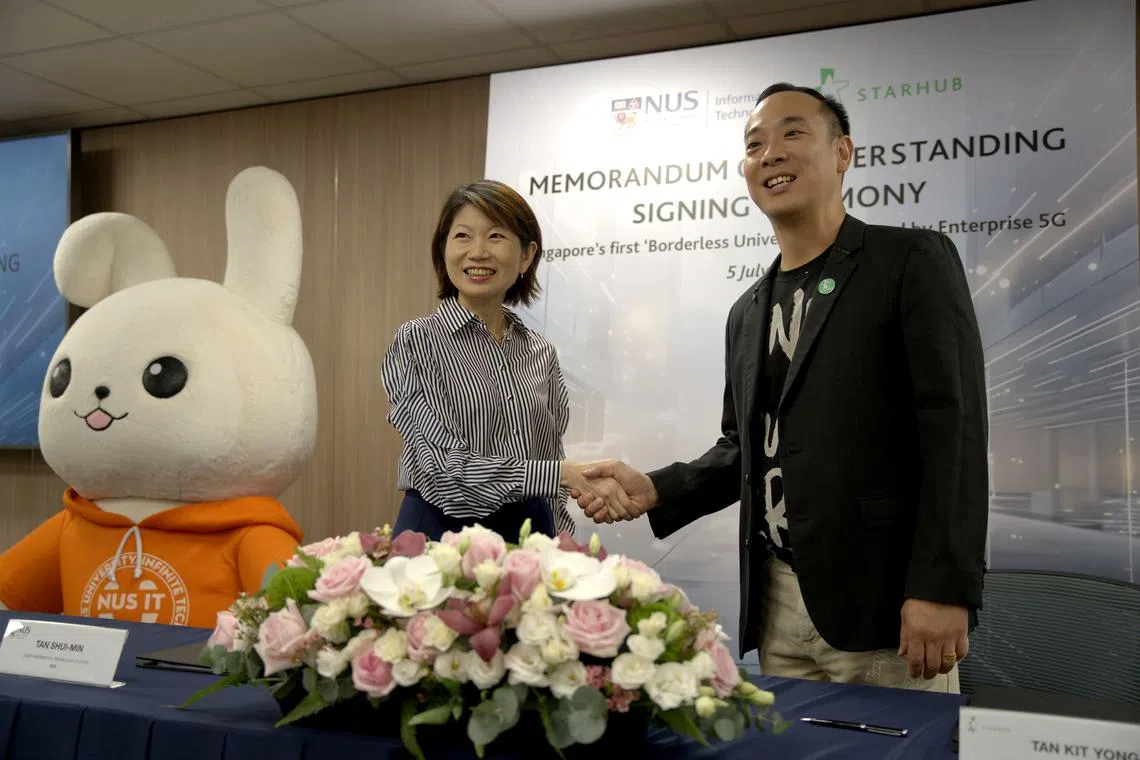 Ms Tan Shui-Min, the chief information technology Officer of NUS, and Mr Tan Kit Yong, StarHub’s head of enterprise business group, at an MOU signing ceremony.