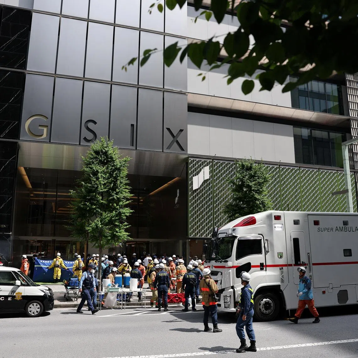 Emergency services workers working on scene in front of the Ginza Six shopping complex in Tokyo on May 25.