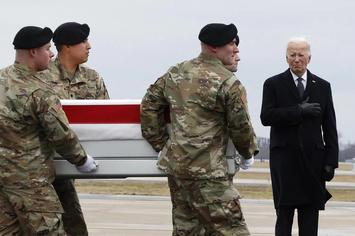 DOVER, DELAWARE - FEBRUARY 02: U.S. President Joe Biden salutes as a U.S. Army carry team moves a flagged dragged transfer case containing the remains of Army Sgt. Kennedy Sanders during a dignified transfer at Dover Air Force Base on February 02, 2024 in Dover, Delaware. U.S. Army Sgt. William Rivers, Sgt. Breonna Moffett, Sgt. Kennedy Sanders were killed in addition to 40 others troops were injured during a drone strike in Jordan.   Kevin Dietsch/Getty Images/AFP (Photo by Kevin Dietsch / GETTY IMAGES NORTH AMERICA / Getty Images via AFP)