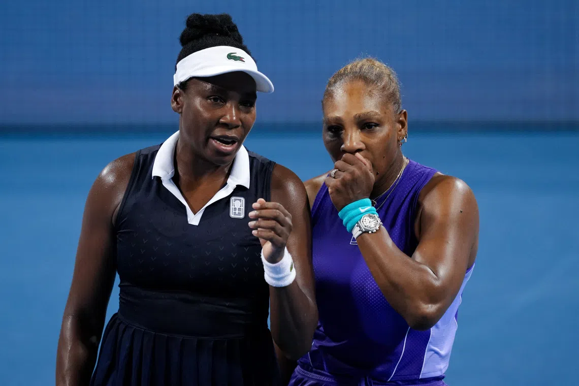 Aug 17, 2026; Mason, OH, USA;  Serena Williams and Venus Williams of the United States talk after a point against Marta Kostyuk of Ukraine and Peyton Stearns of the United States in their doubles match during the Cincinnati Open at Lindner Family Tennis Center. Mandatory Credit: Aaron Doster-Imagn Images