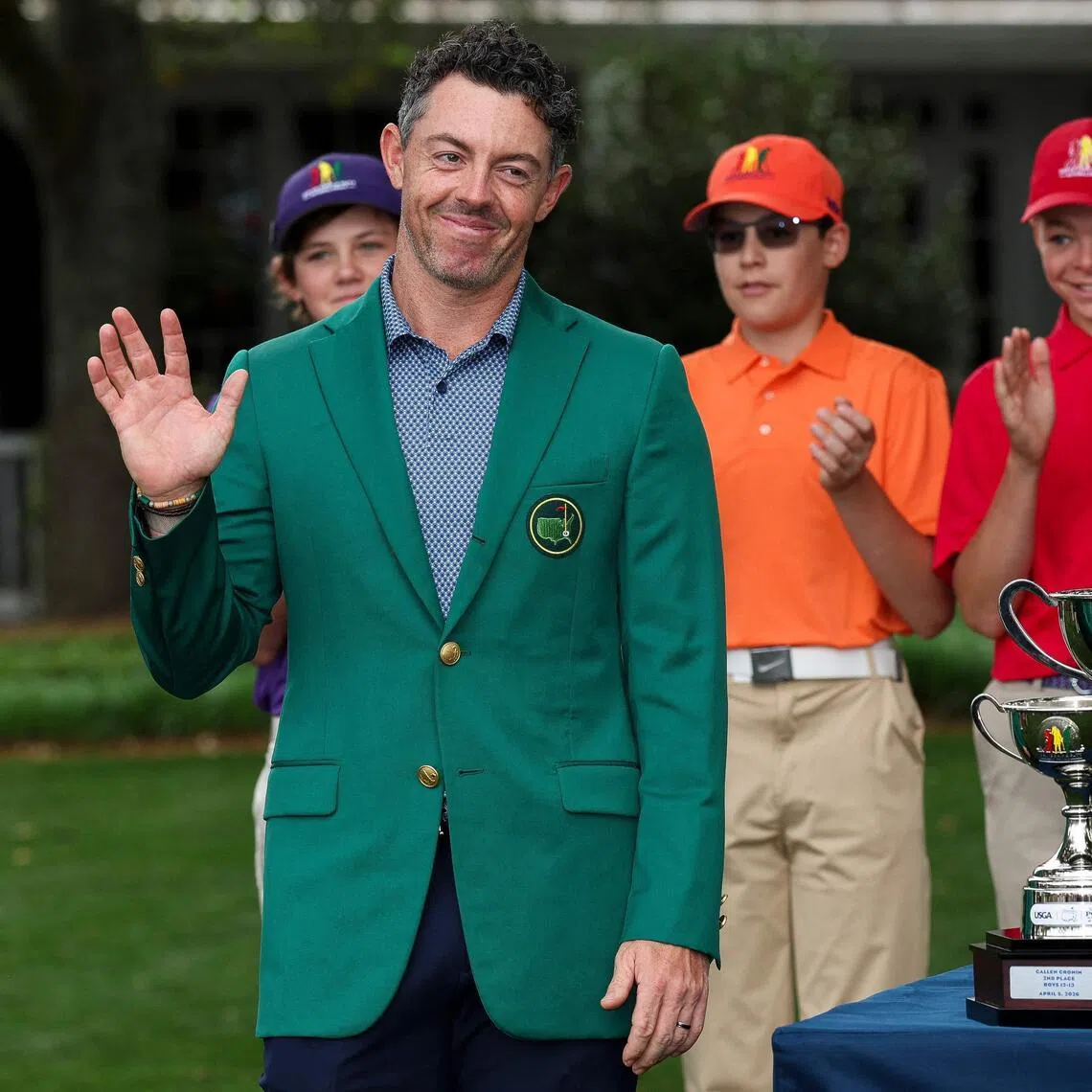 Masters champion Rory McIlroy poses with young golfers during the Drive, Chip and Putt Championship at Augusta National Golf Club on April 5. 