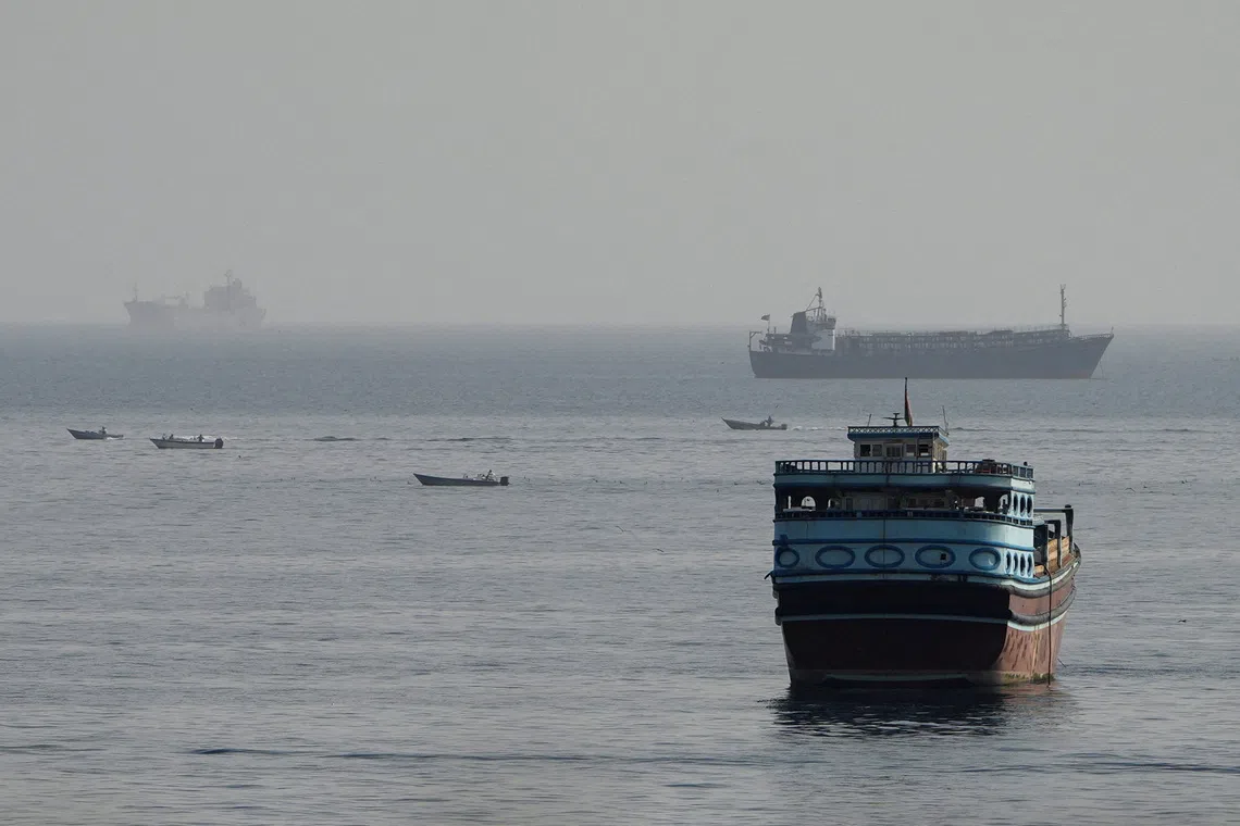 Vessels are anchored in the Strait of Hormuz, as seen from Musandam, Oman.