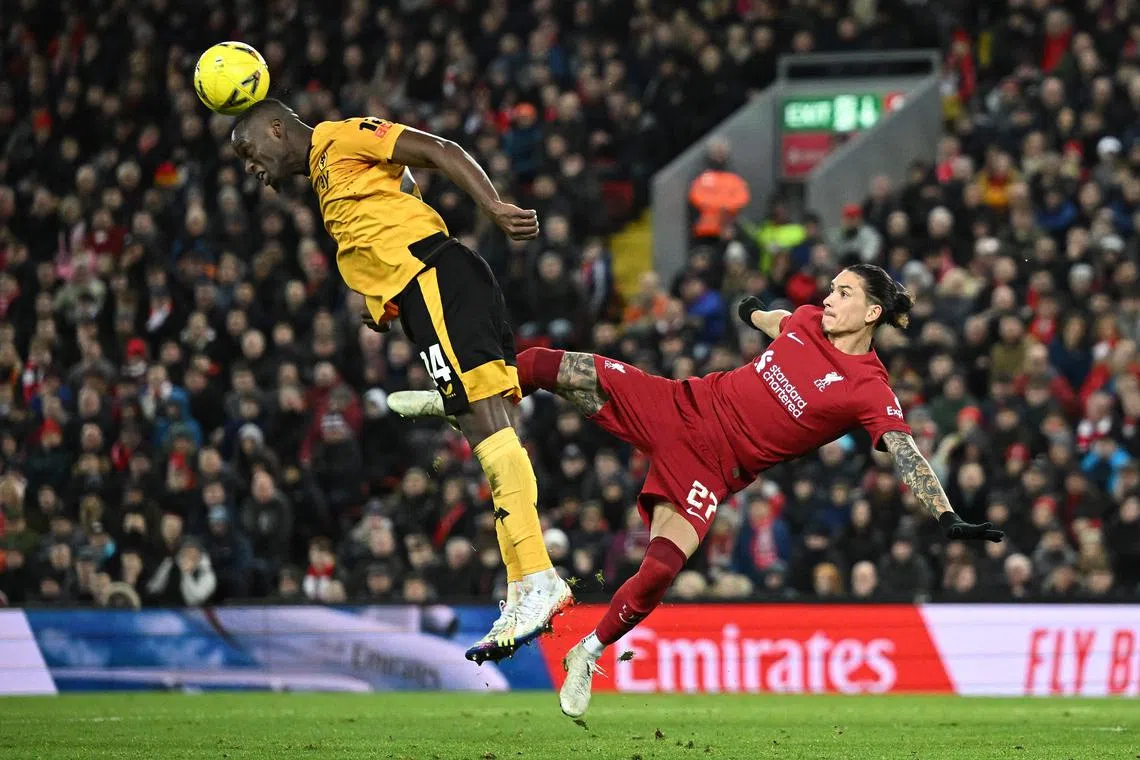 Liverpool's Uruguayan striker Darwin Nunez (right) vies for the ball during the match against Wolves at Anfield.