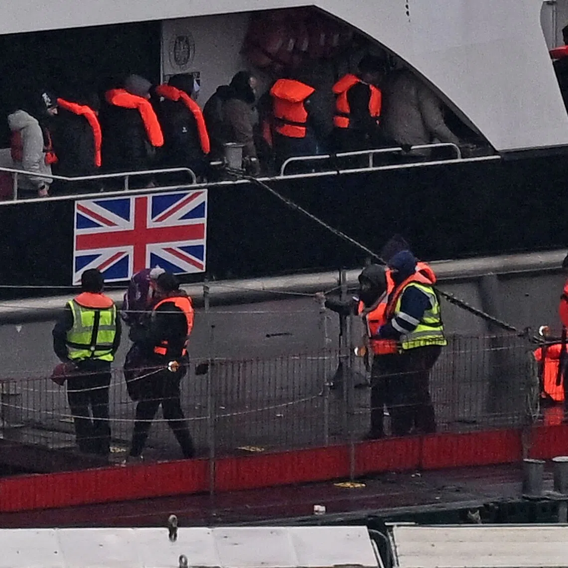 Migrants disembarking from a Border Force vessel in Dover, south-east England, in February, after they were picked up at sea attempting to cross the English Channel from France.