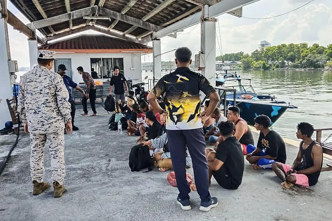 Survivors rescued from a boat that sank off Pangkor island in Perak on May 11, seen here in a photo released by the Malaysian Maritime Enforcement Agency on May 12.