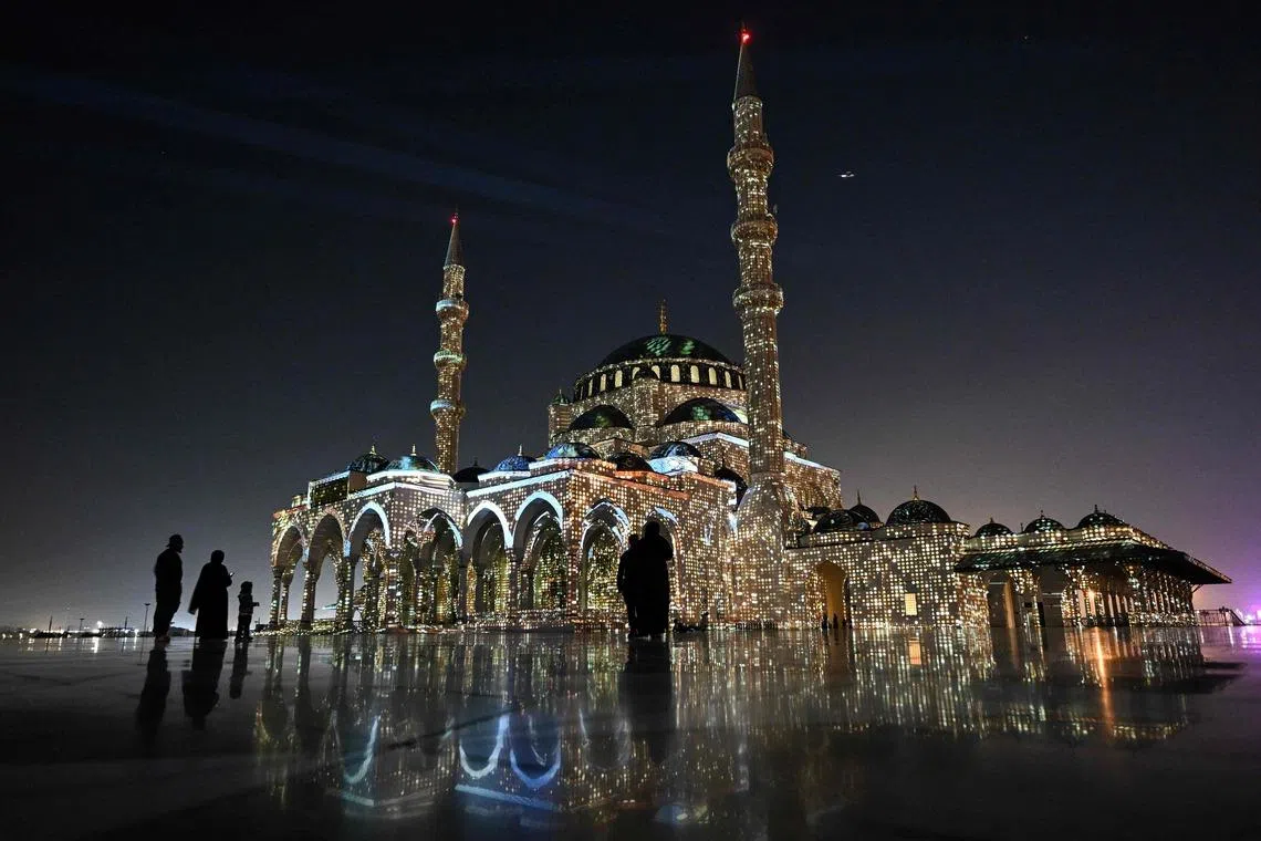 The Sharjah Mosque is lit up in a colourful display for the 15th annual Sharjah Light Festival in the emirate of Sharjah in the United Arab Emirates
 on Feb 3, 2026. 
