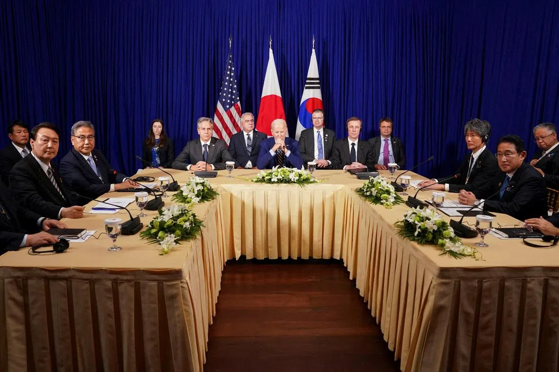 US President Joe Biden holds a trilateral meeting with Japanese Prime Minister Fumio Kishida and South Korean President Yoon Suk-yeol on Nov 13, 2022.