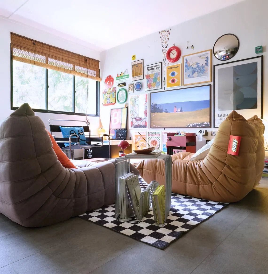 The television set is part of a gallery wall.