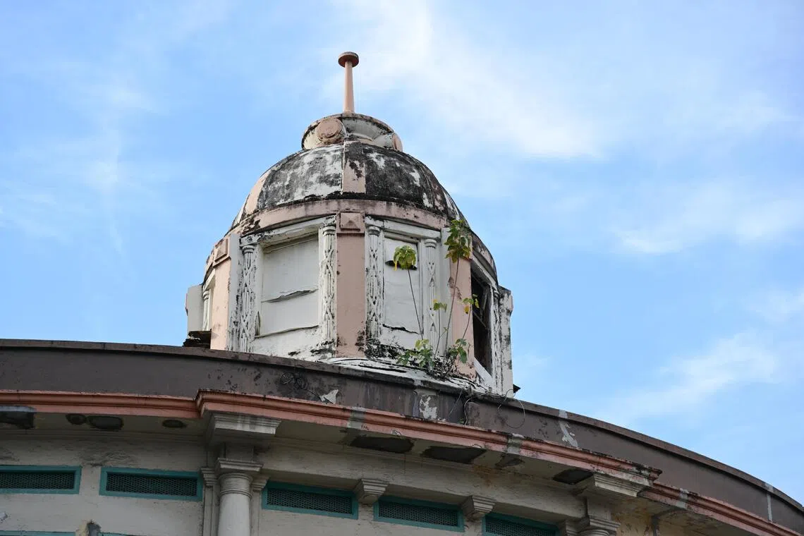 Twin-domed Ellison Building: Colonial governors watched horse races from its rooftop, which was also rented to Rex Cinema for movie signages.