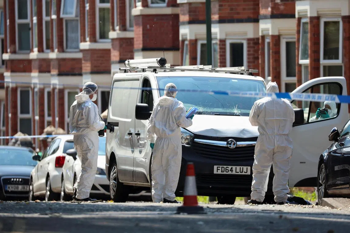 Police forensic officers at the scene of the stabbing on Tuesday.