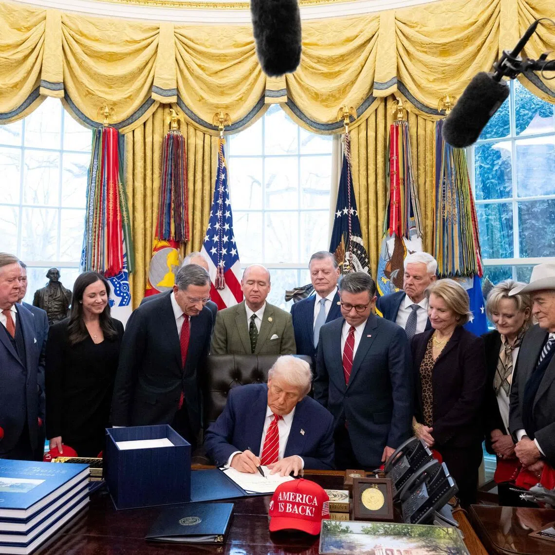 US President Donald Trump signs a funding Bill to end a partial government shutdown in the Oval Office of the White House on Feb 3.