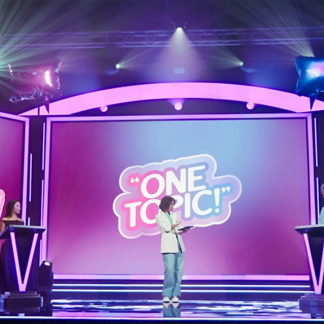 CNB’s new game show Pop My POV is hosted by Caitanya Tan (centre), with Chow Jia Hui (left) and Cavin Chua in a head-to-head debate about drug use.