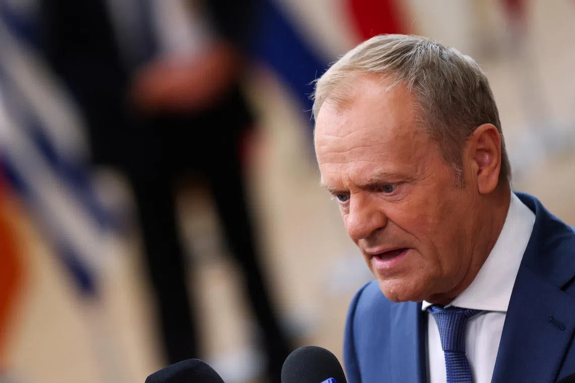 Poland's Prime Minister Donald Tusk speaks to the media on the first day of a European Union leaders' summit in Brussels, Belgium June 27, 2024. REUTERS/Johanna Geron