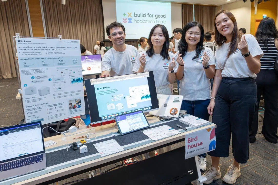 Developer Carlos Chacon (left) and team members presenting their matchbox-size device called Birdhouse at the Build For Good 2024 citizen hackacthon finale.