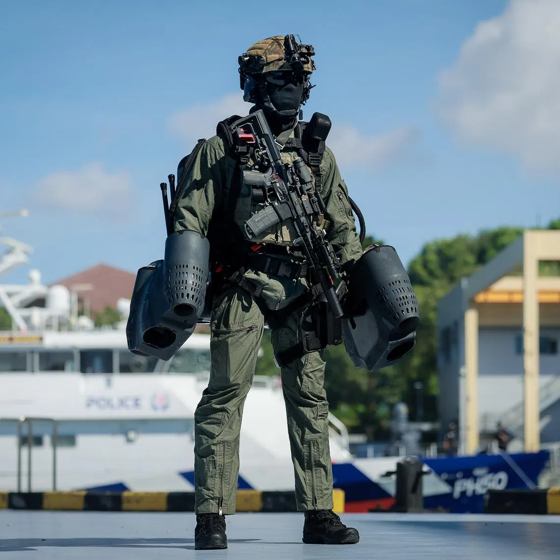 A Police Coast Guard Special Task Squadron officer wears a jet-propelled manpack during a demonstration on May 14.