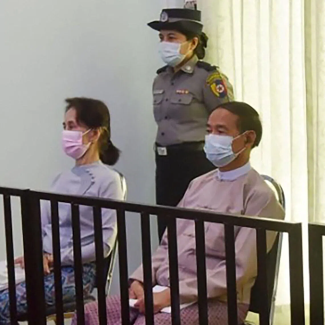 Myanmar's former Myanmar leader Aung San Suu Kyi and president Win Myint in court in May 2021.