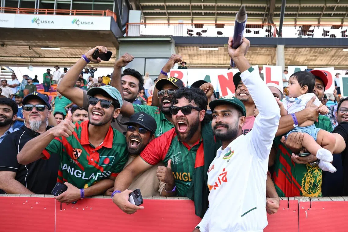 Bangladesh’s Mehidy Hasan Miraz celebrating with fans after defeating Australia on Aug 16.
