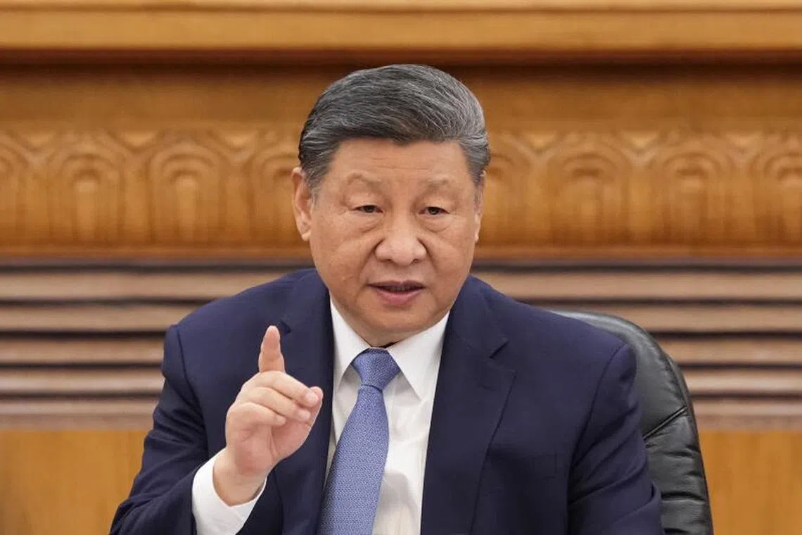 China's President Xi Jinping speaks during a meeting with global business leaders at the Great Hall of the People, in Beijing.