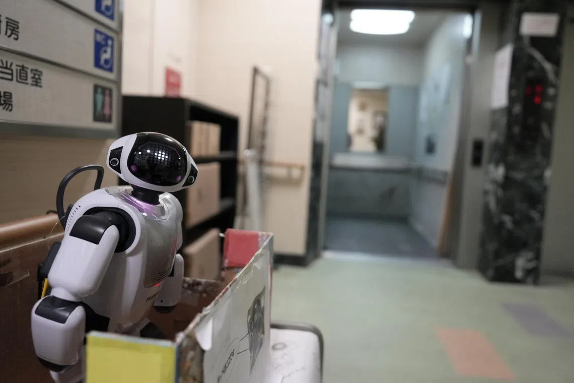 A communication robot, Palro standing at the entrance of Shintomi nursing home in Tokyo, Japan on April 7, 2023.  