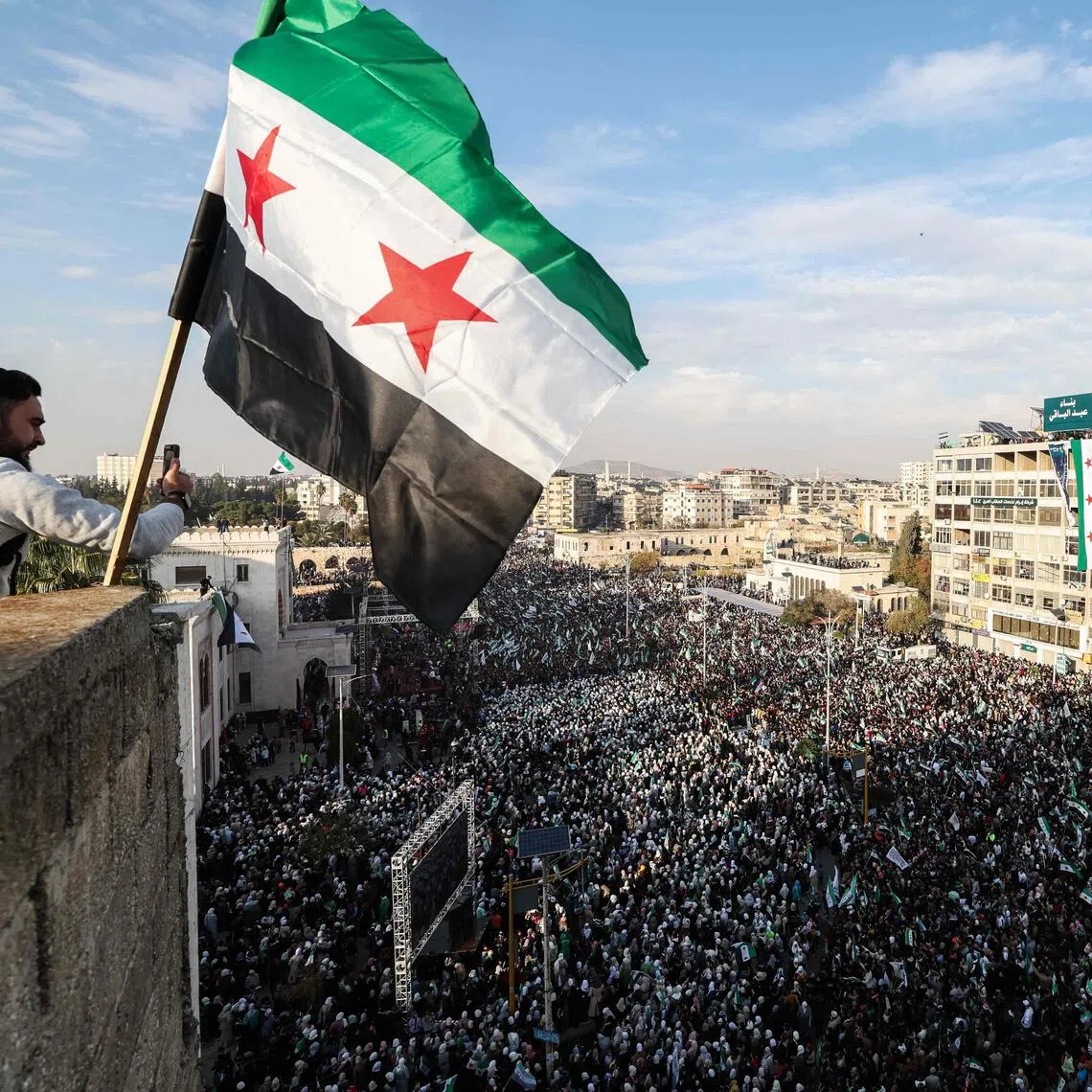 Syrians celebrate the anniversary of the December 2024 ouster of longtime ruler Bashar al-Assad.