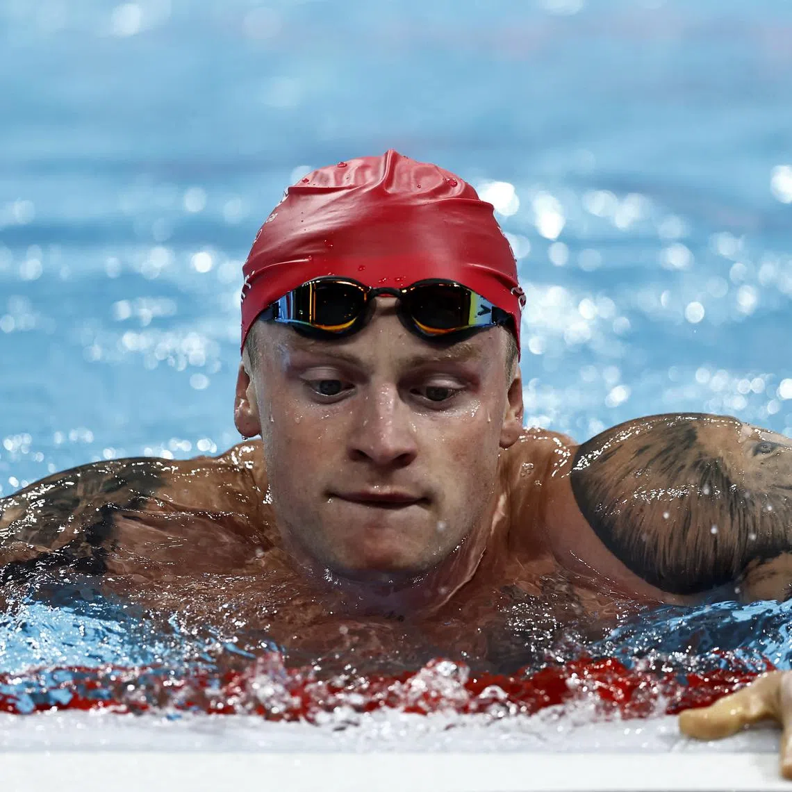 Paris 2024 Olympics - Swimming - Men's 4 x 100m Medley Relay Final - Paris La Defense Arena, Nanterre, France - August 04, 2024. Adam Peaty of Britain reacts after the race. REUTERS/Clodagh Kilcoyne