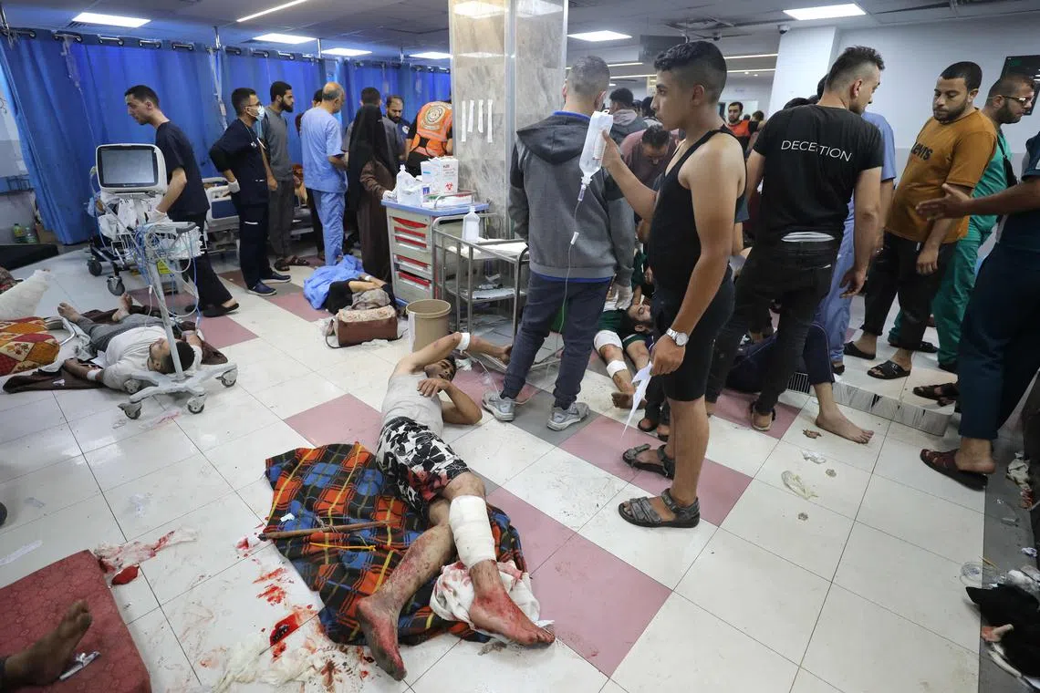 Wounded Palestinians receive treatment at the Al-Shifa hospital in Gaza City.