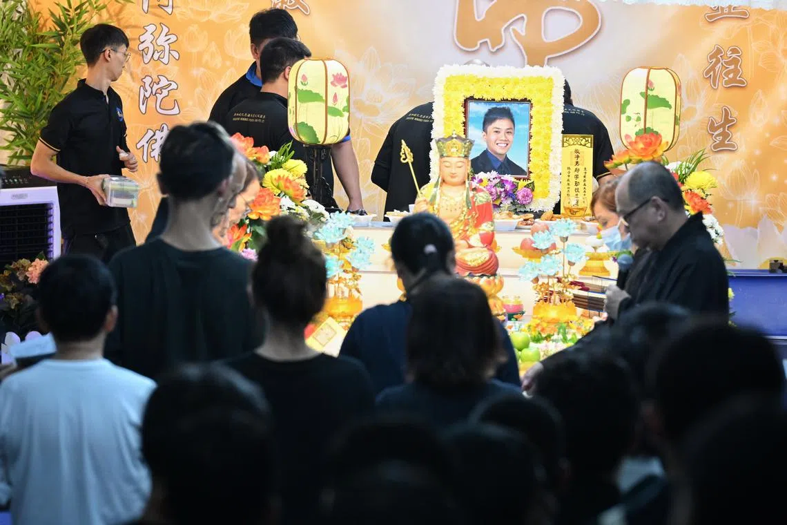 Friends and relatives of Captain Kenneth Tay Xue Qin pay their respects to him on May 17.