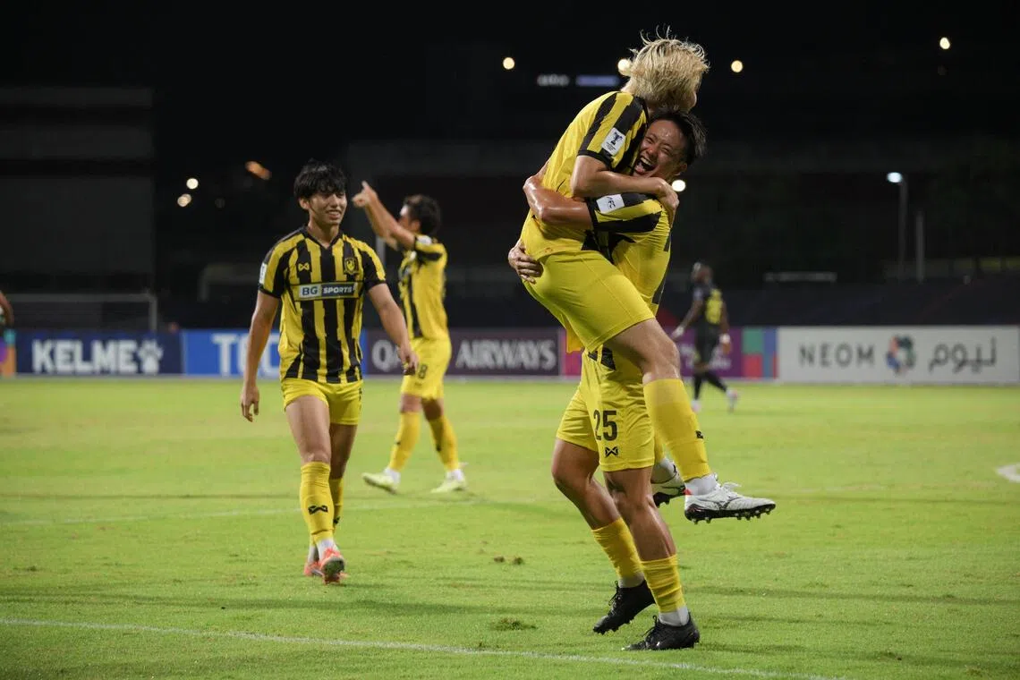 Hide Higashikawa (right) of Tampines Rovers FC celebrating with Seiga Sumi after scoring against Kaya-Iloilo during the AFC Champions League Two match with Glenn Kweh watching on.