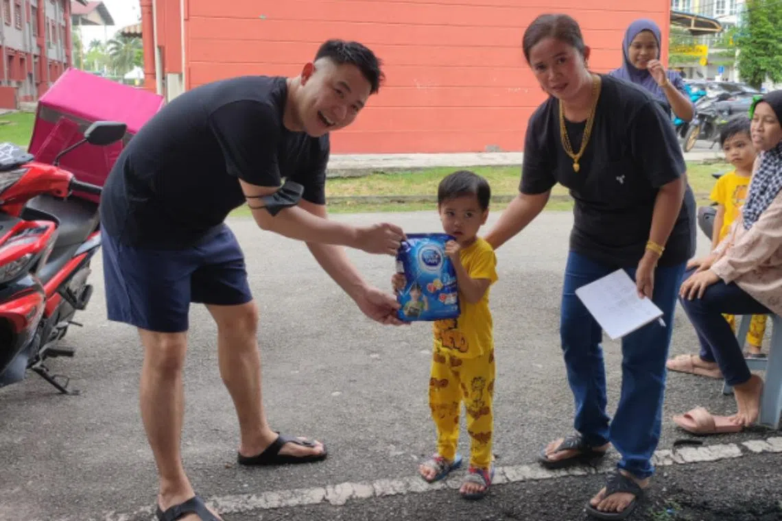 Mr Klaus Lim and his team handed out aid such as milk formula and diapers to the needy in his hometown of Batu Pahat in Johor.