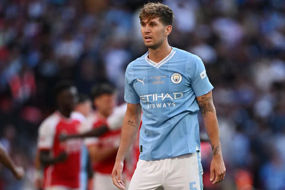 FILE PHOTO: Soccer Football - Community Shield - Manchester City v Arsenal - Wembley Stadium, London, Britain - August 6, 2023  Manchester City's John Stones reacts after Arsenal's Leandro Trossard scores their first goal REUTERS/Dylan Martinez/File Photo