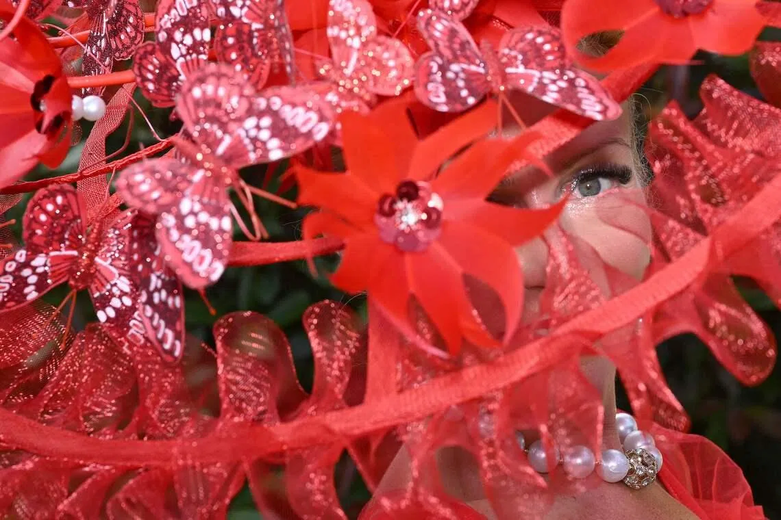 A racegoer posing for a picture in her hat on the first day of the Royal Ascot horse racing meeting in Ascot, west of London, on June 16, 2026.