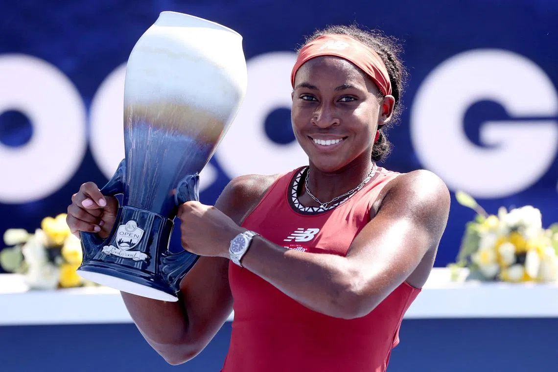 Coco Gauff poses with the trophy after defeating Karolina Muchova, of the Czech Republic.