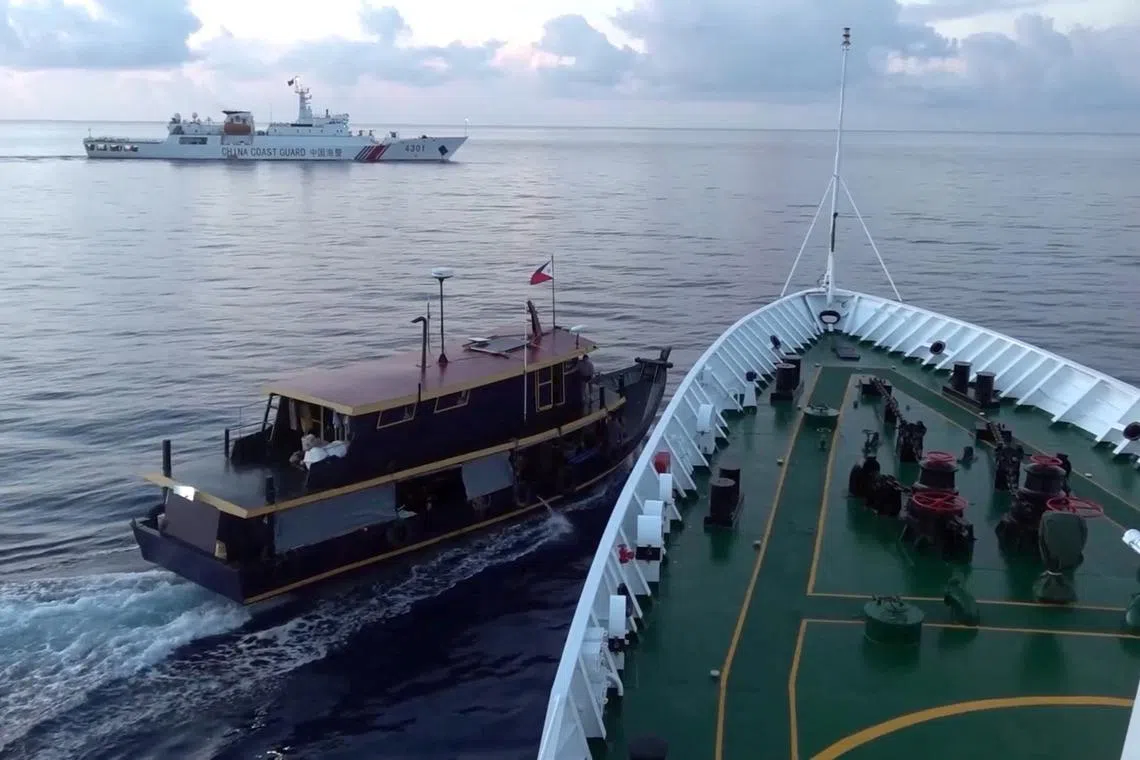 A Philippine flagged boat is blocked by a China Coast Guard vessel in an incident that resulted in a collision.