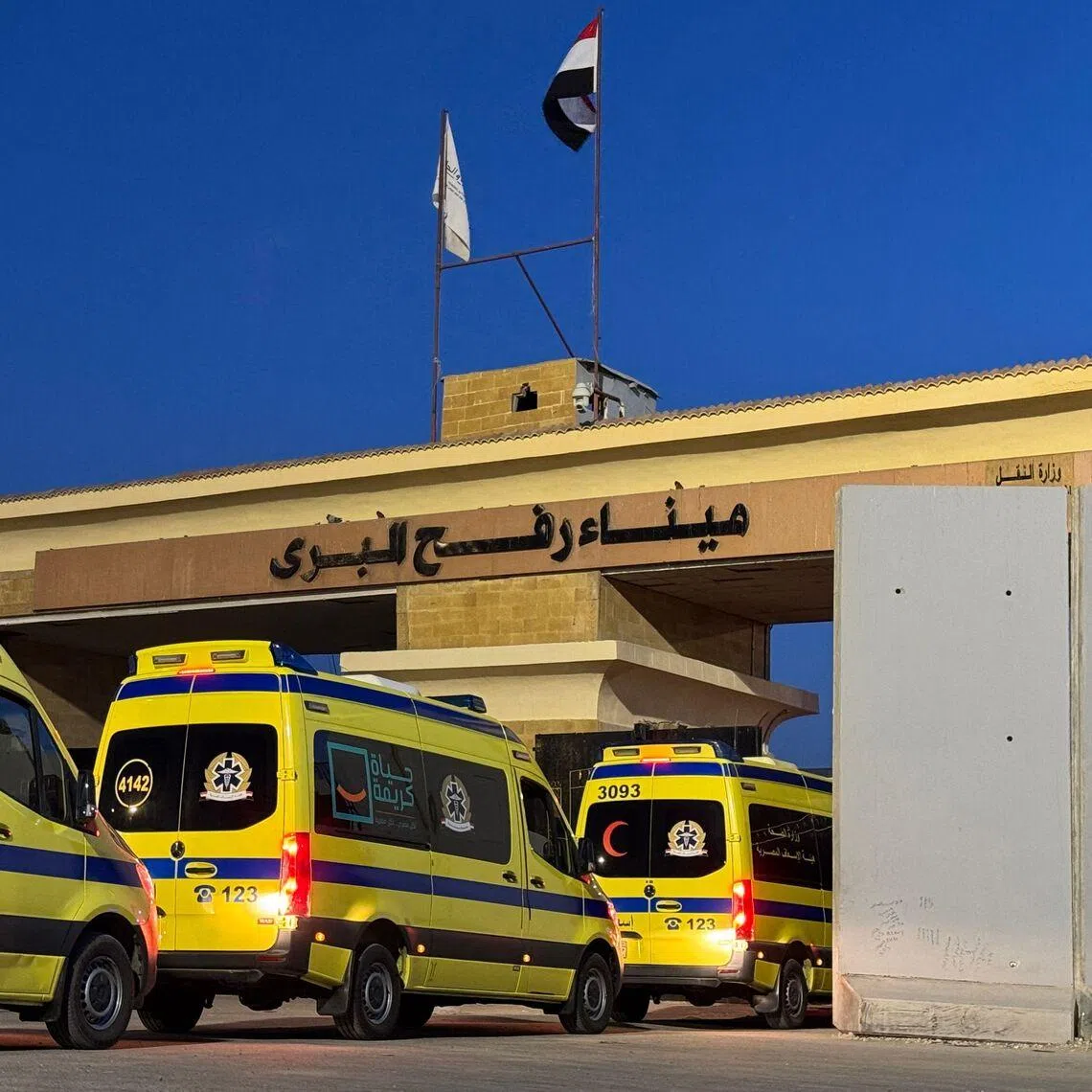 Ambulances waiting at the Egyptian side of the Rafah border crossing with the Palestinian Gaza Strip on Feb 2.