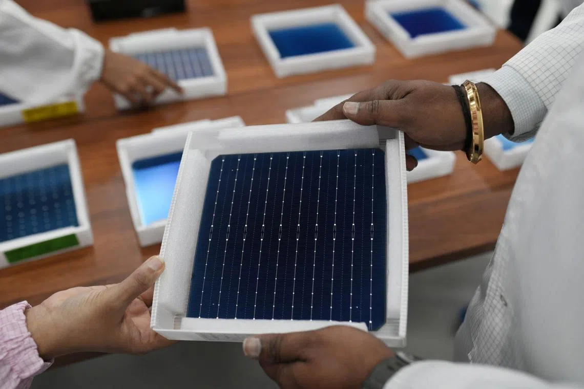Tariffs for solar wafers (above) and polysilicon will double in January to 50 per cent, while those on certain tungsten products will rise from zero to 25 per cent.