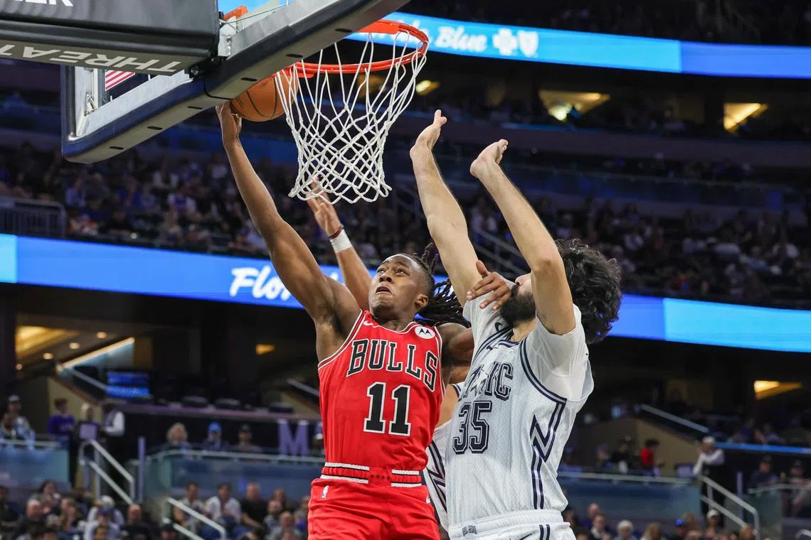 Chicago Bulls guard Ayo Dosunmu goes to the basket against Orlando Magic centre Goga Bitadze during the second half at Kia Centre.