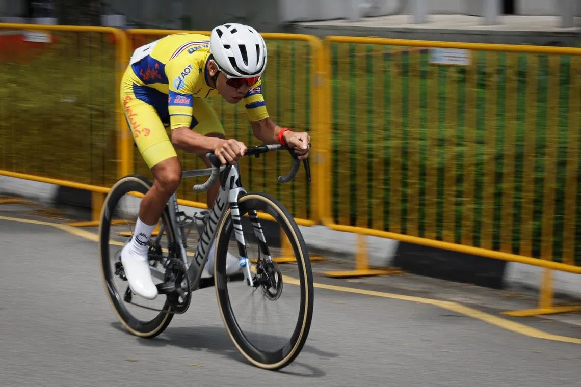 Thailand's Thanakan Chaiyasombat helping his team win the  OCBC Cycle Speedway SEA Championship at the Singapore Sports Hub on May 11.