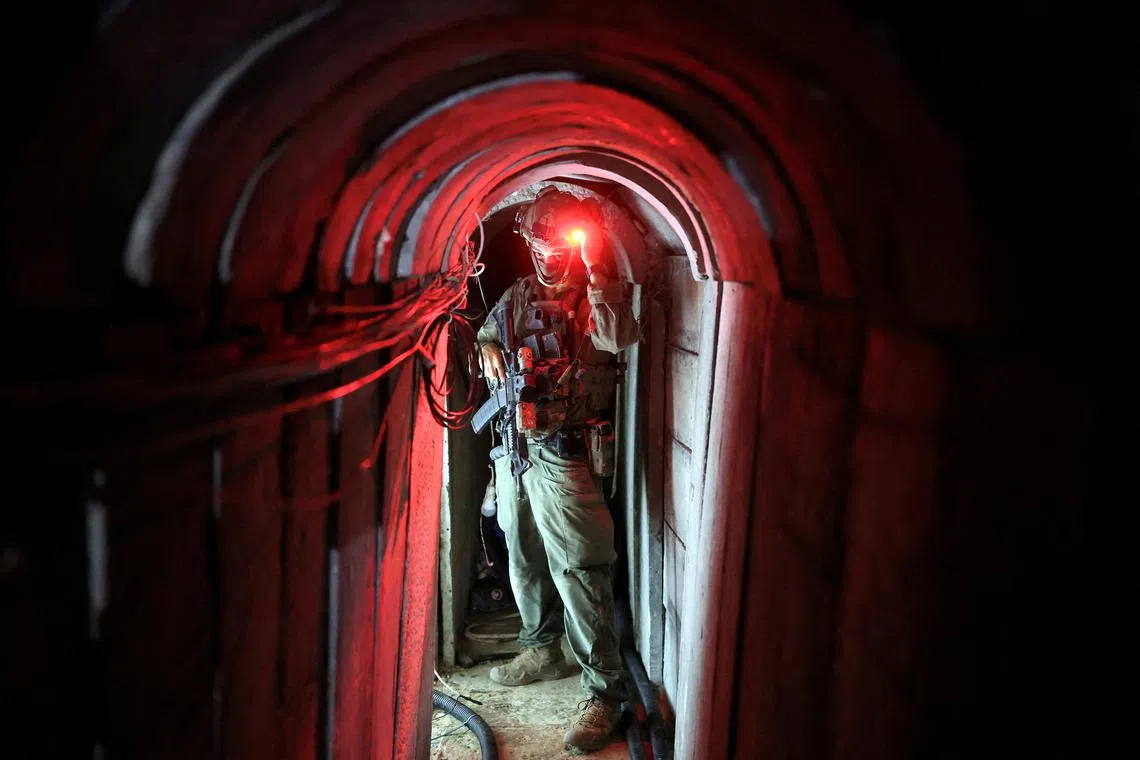 An Israeli soldier standing inside a tunnel underneath the European Hospital in Khan Younis at the Gaza Strip, amid the ongoing ground operation of the Israeli army against Palestinian Islamist group Hamas, on June 8, 2025. 