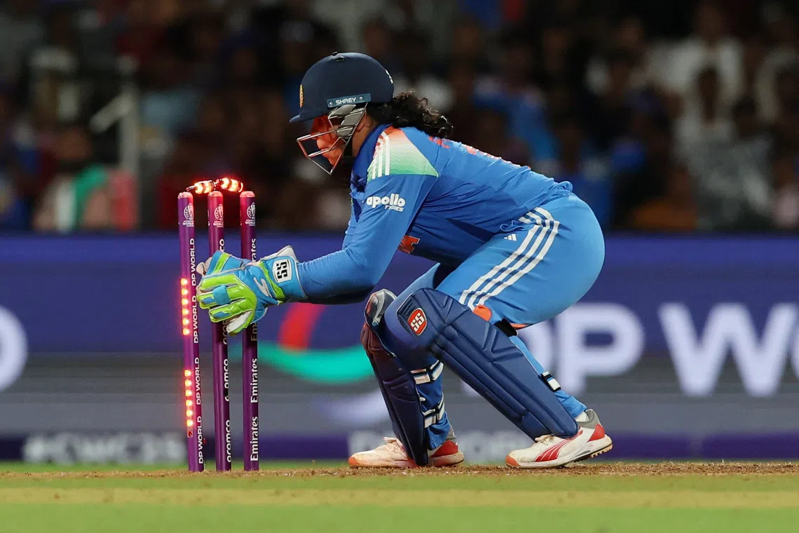 Cricket - ICC Women's World Cup - Final - India v South Africa - DY Patil Stadium, Navi Mumbai, India - November 2, 2025 India's Richa Ghosh runs out Ayabonga Khaka REUTERS/Francis Mascarenhas