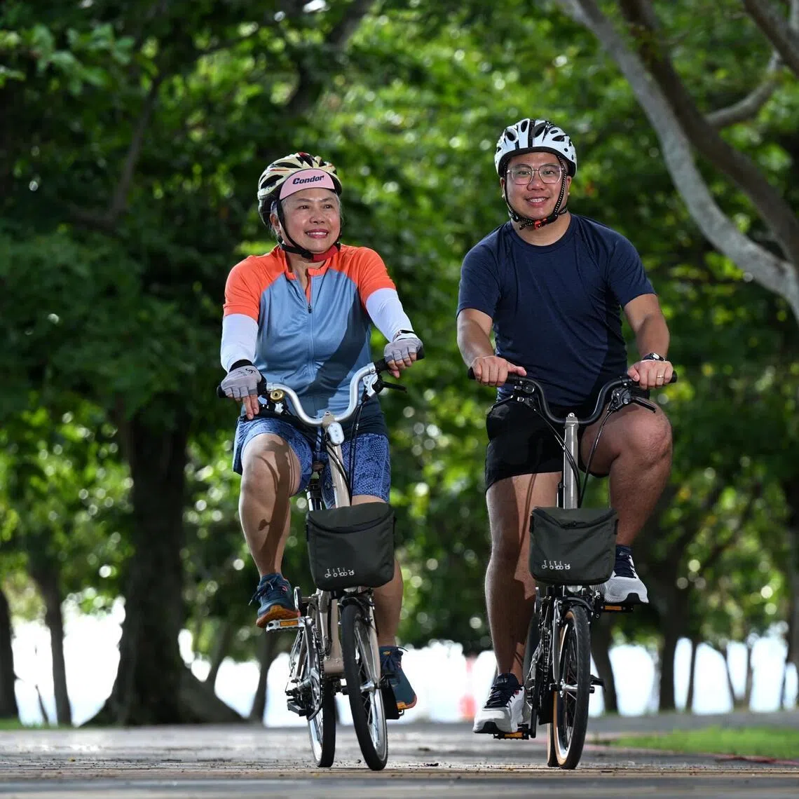 Jane Low (left) and her son, Stanford Chong cycling at Changi coast track on April 17. They will be participating in the  OCBC Cycle on May 10.