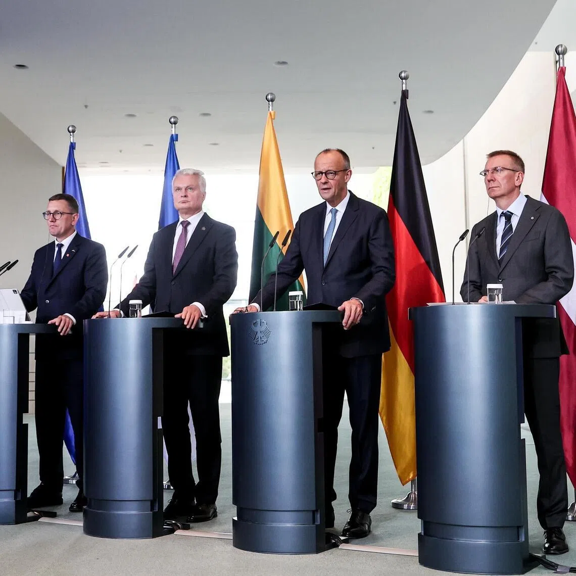 German Chancellor Friedrich Merz (third from left) giving a press briefing in Berlin on July 3, with (from left) Estonian Prime Minister Kristen Michal, Lithuanian President Gitanas Nauseda and Latvian President Edgars Rinkevics. PHOTO: EPA
