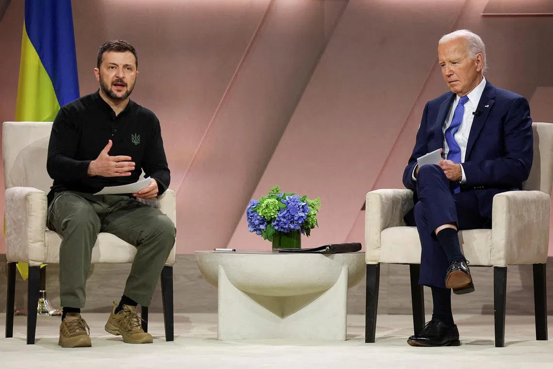 FILE PHOTO: U.S. President Joe Biden and Ukraine's President Volodymyr Zelenskiy attend a bilateral meeting, during NATO's 75th anniversary summit, in Washington, U.S., July 11, 2024. REUTERS/Leah Millis/File Photo